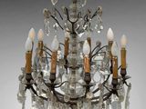 an image of a crystal chandelier with five lights hanging from it