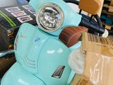 a scooter that is sitting in the middle of a pile of boxes