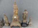 a lot of statues that are sitting on a table