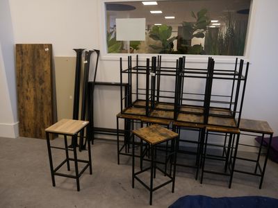 a room with a bunch of tables and chairs in it