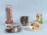 four different types of glass items on a white surface