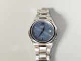 an image of a close up of a wrist watch on a white surface