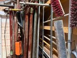 a lot of tools that are hanging on the wall