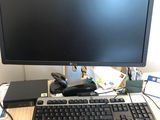 an image of a computer desk with a monitor and keyboard