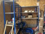 a room with a ladder, shelves, and a ladder in it