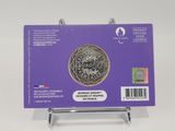 a purple card with a picture of a coin on it