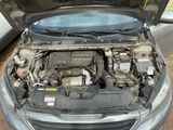 a car with its hood open and the engine in it