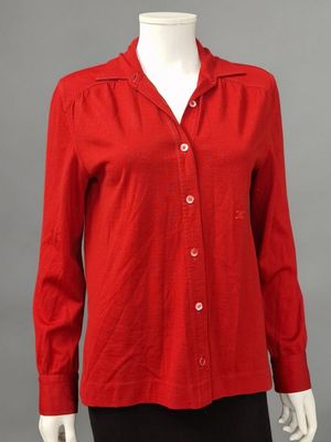 a woman ' s red shirt on a mannequin mannequin mannequin mannequin mann