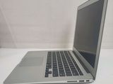 a laptop computer sitting on a table with a white background