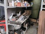 a garage with a lot of junk on the shelves