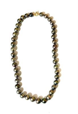 a close up of a necklace on a white background