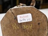 a piece of wood with writing on it on a table