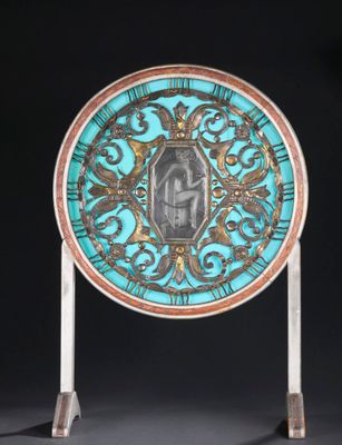 a close up of a blue and gold plate with a picture on it