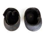 a pair of shoes that are sitting on a white surface
