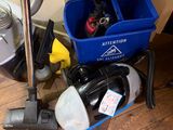 a blue bucket with a vacuum and other cleaning supplies on the floor