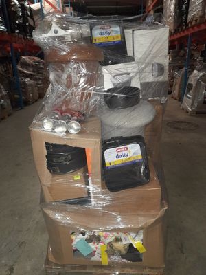 a cart full of items in a warehouse with a lot of boxes