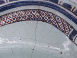 a close up of a blue and white plate with a design on it