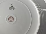 a white plate with a black and white design on it