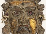 an image of a wooden mask on a white background