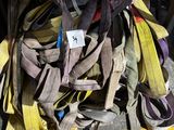 a pile of shoes on the ground under a table