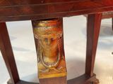 a wooden table with a carved head on it