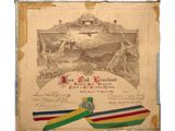 un vieux document orné d'un ruban et d'une médaille