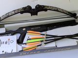 bow and arrows in a box with other items in it
