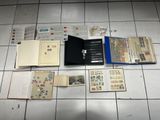 a lot of books that are laying on the floor
