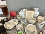a table that has a lot of dishes and cups on it