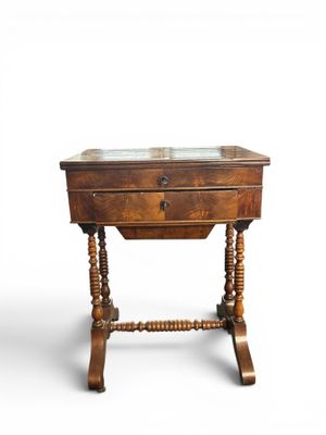 an old wooden table with a glass top on a white background