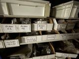 many boxes with labels on them on a shelf