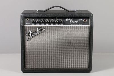 a black and white guitar amplifier sitting on top of a table