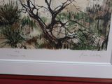 une photo d'un tableau représentant un arbre, dans un cadre