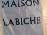 a sign that says maison labichee on the table
