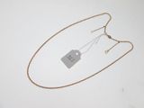 a close up of a necklace with a tag attached to it