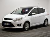 le ford c - max blanc est garé sur un sol en damier