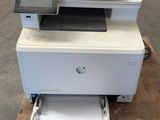 a printer that is sitting on top of a table