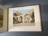 an open book with a picture of a bridge in the middle of it
