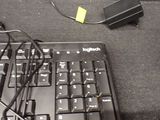 a black keyboard and mouse on a black surface