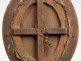 a wooden cross in the middle of a circle