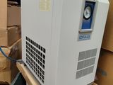 a machine that is sitting on top of a pile of boxes