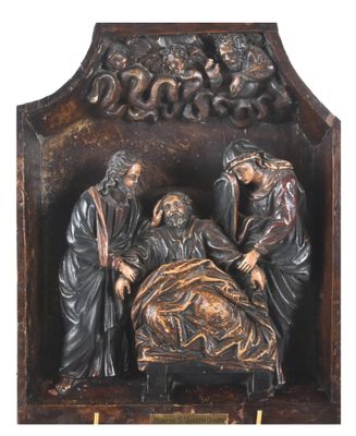 une image représentant une statue d'un homme allongé dans un lit avec une femme et deux hommes