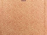 a brown suitcase sitting on a wooden floor next to a white wall