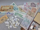 many different types of money and coins on the table