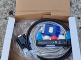 an open box with a cable and a cable connected to it