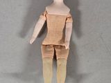 a small doll that is sitting on the floor