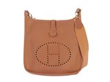 a brown leather handbag with a logo on the front