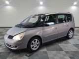 a picture of a silver minivan parked in a room