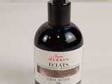 an image of a bottle of eclais facial oil on a white surface