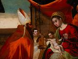an image of a painting of a woman holding a baby in a manger